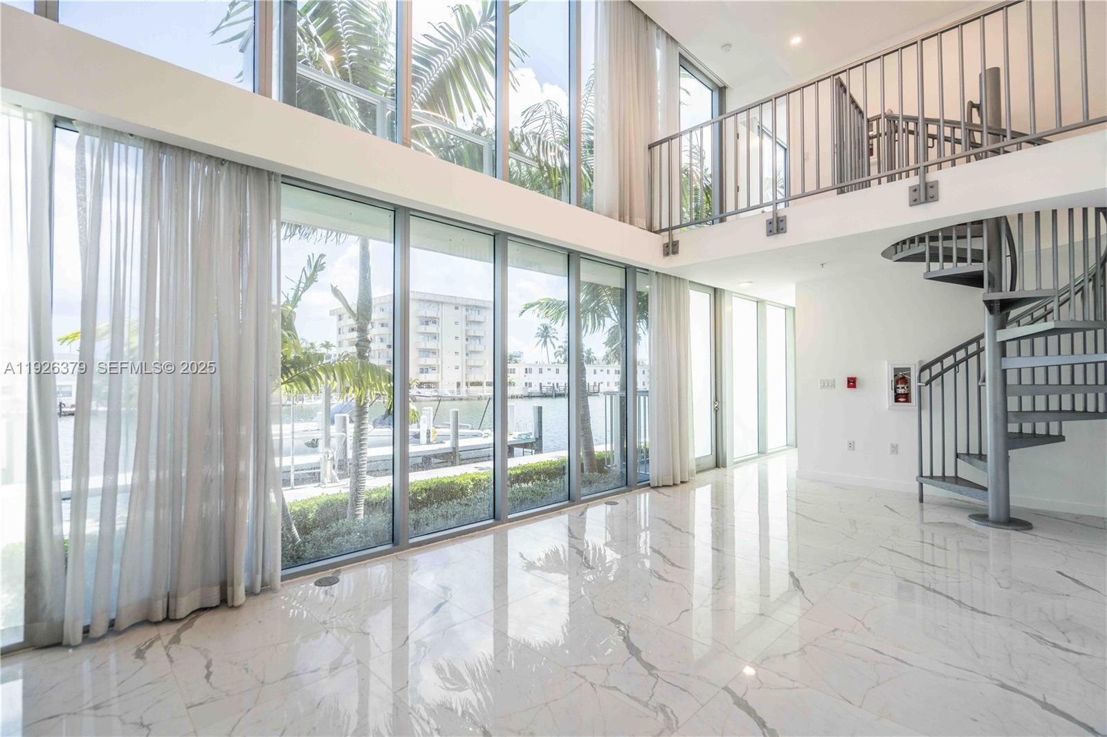 8425 Crespi Boulevard, Unit TH3 Miami Beach, FL 33141 - Photo 4 of 28 a view of an entryway with staircase