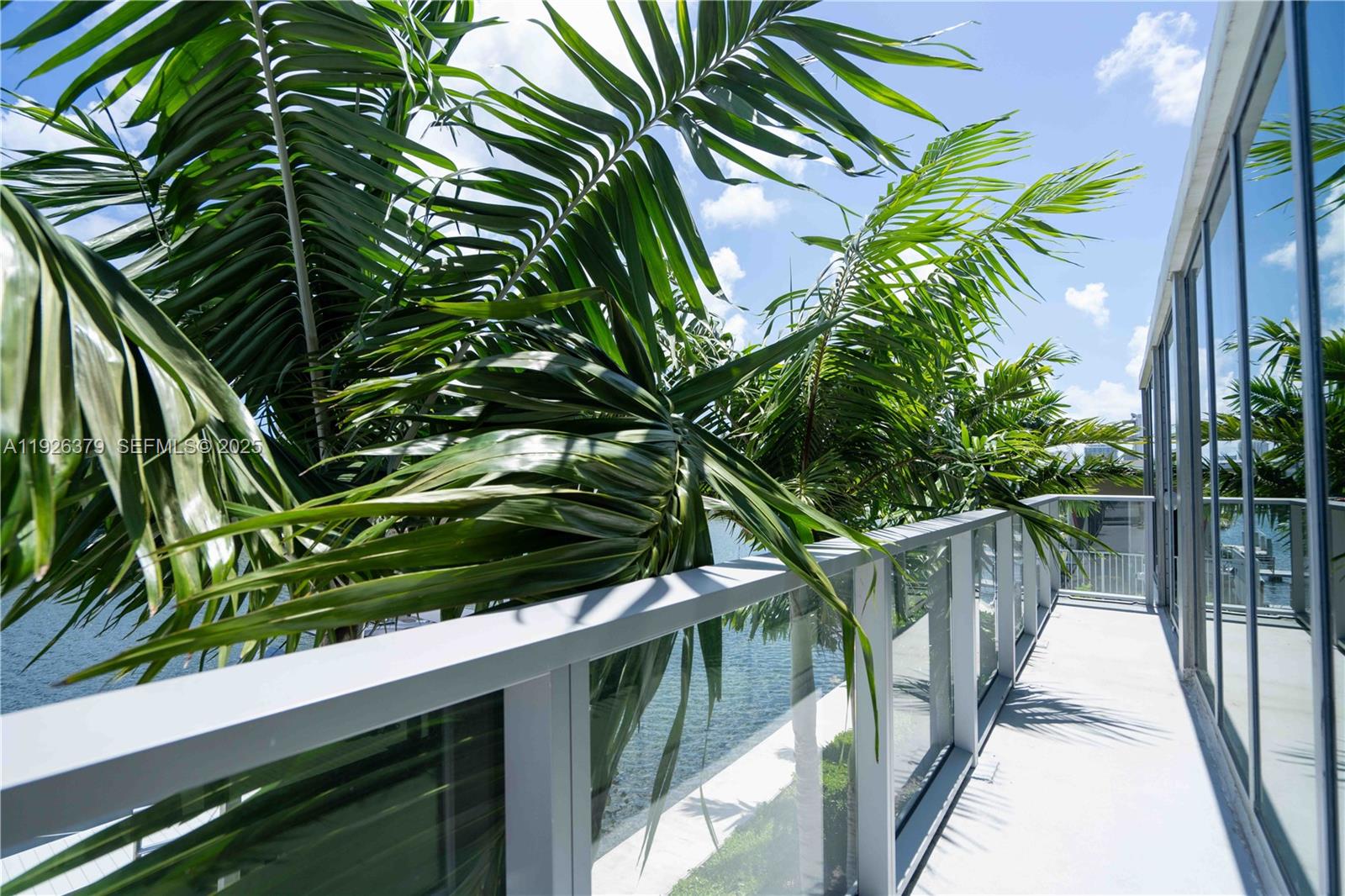8425 Crespi Boulevard, Unit TH3 Miami Beach, FL 33141 - Photo 5 of 28 a view of balcony with wooden floor