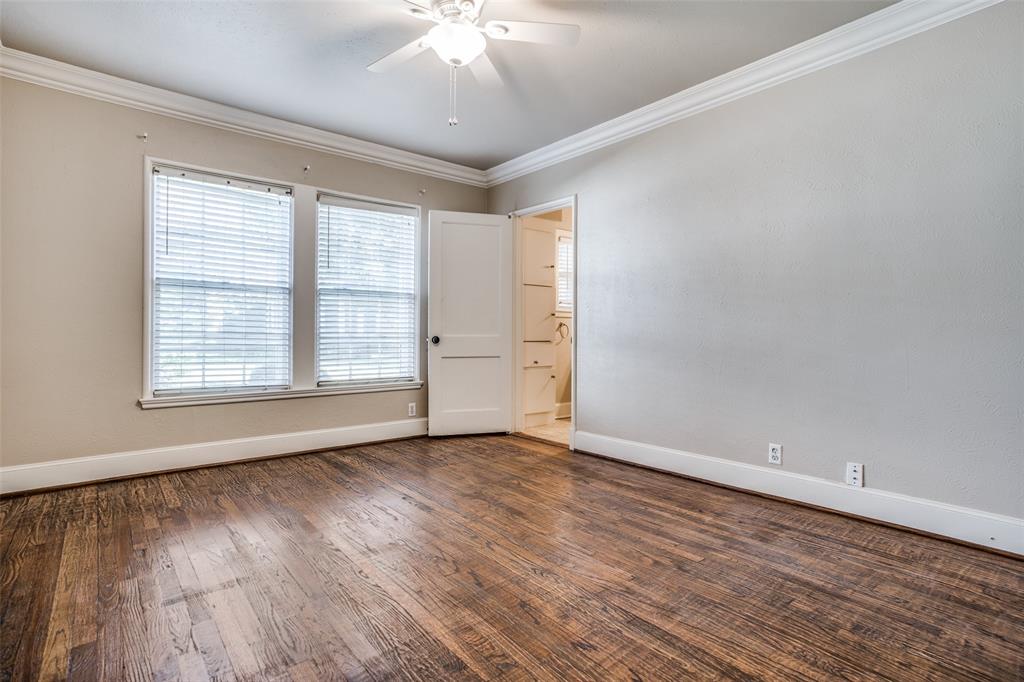 4558 Roland Avenue, Unit B Highland Park, TX 75219 - Photo 6 of 10 wooden floor in an empty room with a window