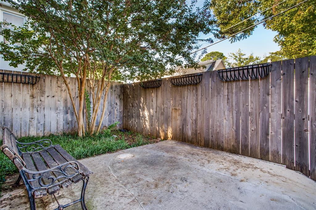 4558 Roland Avenue, Unit B Highland Park, TX 75219 - Photo 10 of 10 a backyard of a house with lots of green space