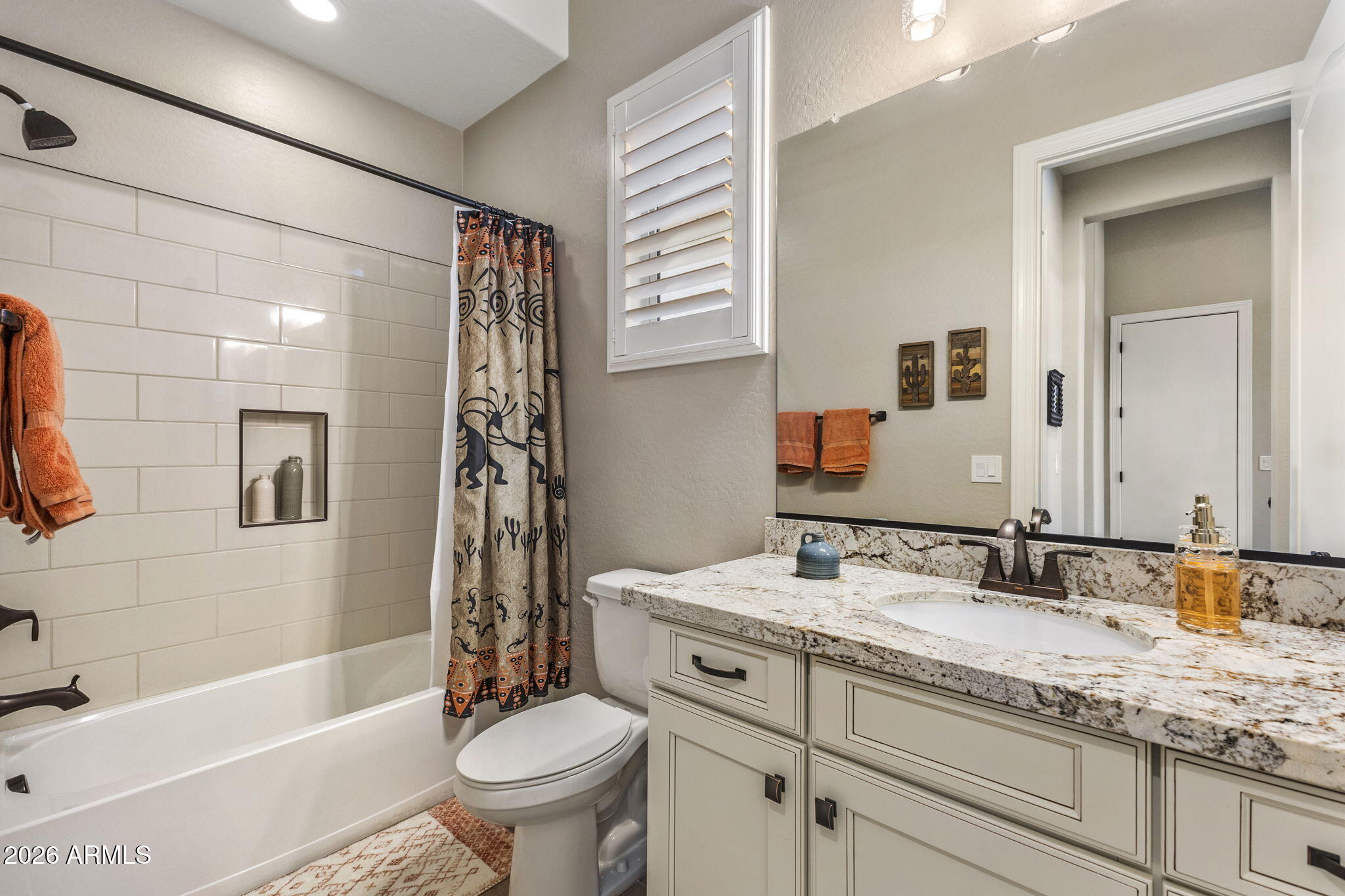 18785 East Blue Sky Drive Rio Verde, AZ 85263 - Photo 11 of 23 a bathroom with a granite countertop sink a toilet a mirror a vanity a bath tub and shower