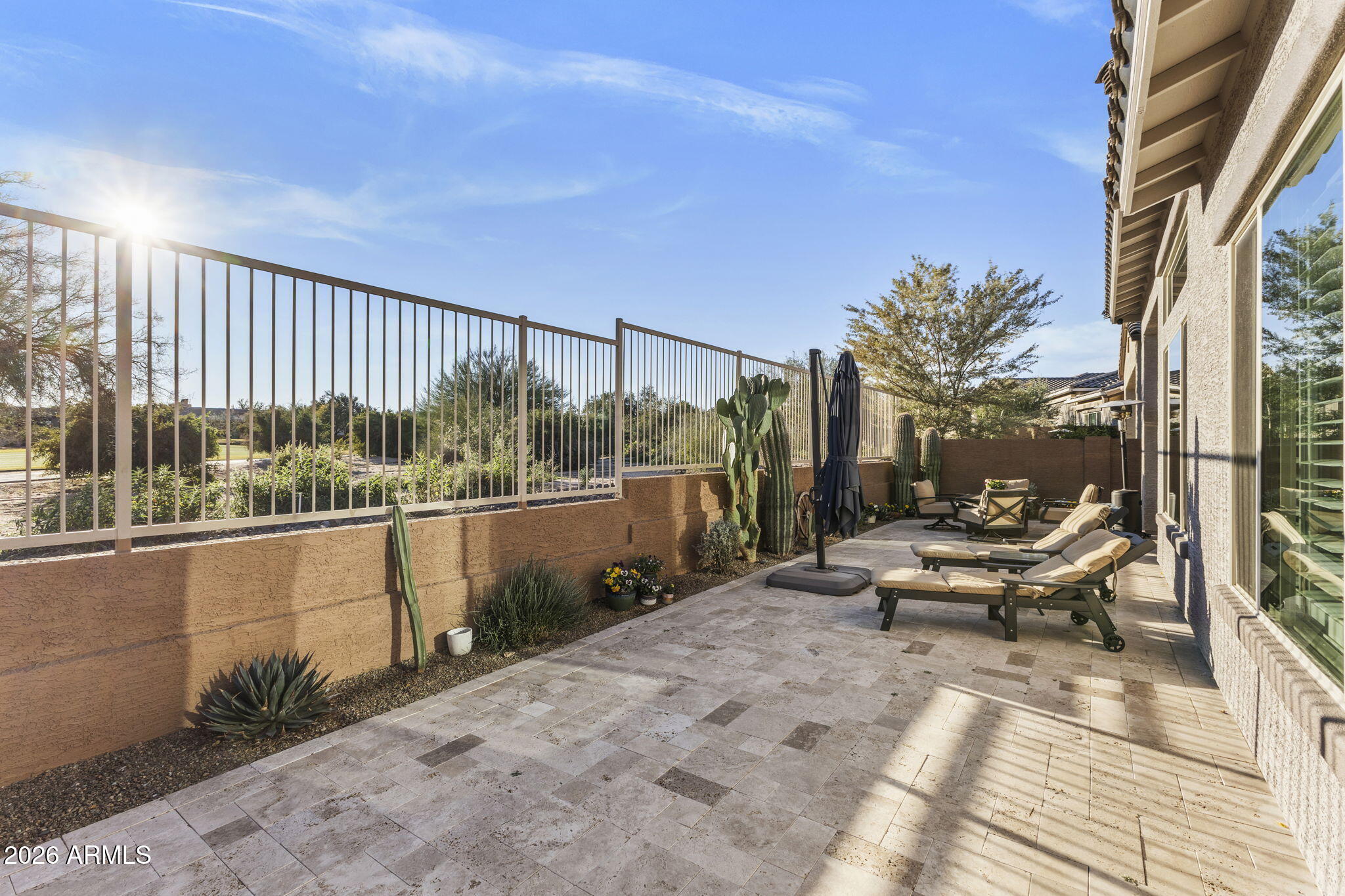 18785 East Blue Sky Drive Rio Verde, AZ 85263 - Photo 17 of 23 a view of a balcony with couch and wooden fence