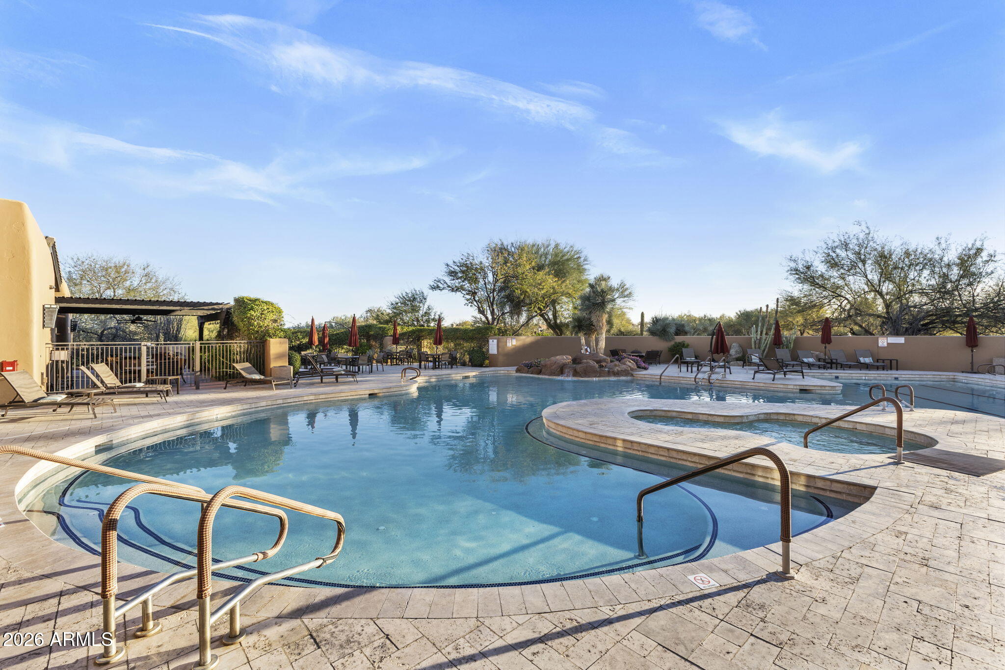18785 East Blue Sky Drive Rio Verde, AZ 85263 - Photo 20 of 23 a view of a swimming pool with outdoor seating and plants