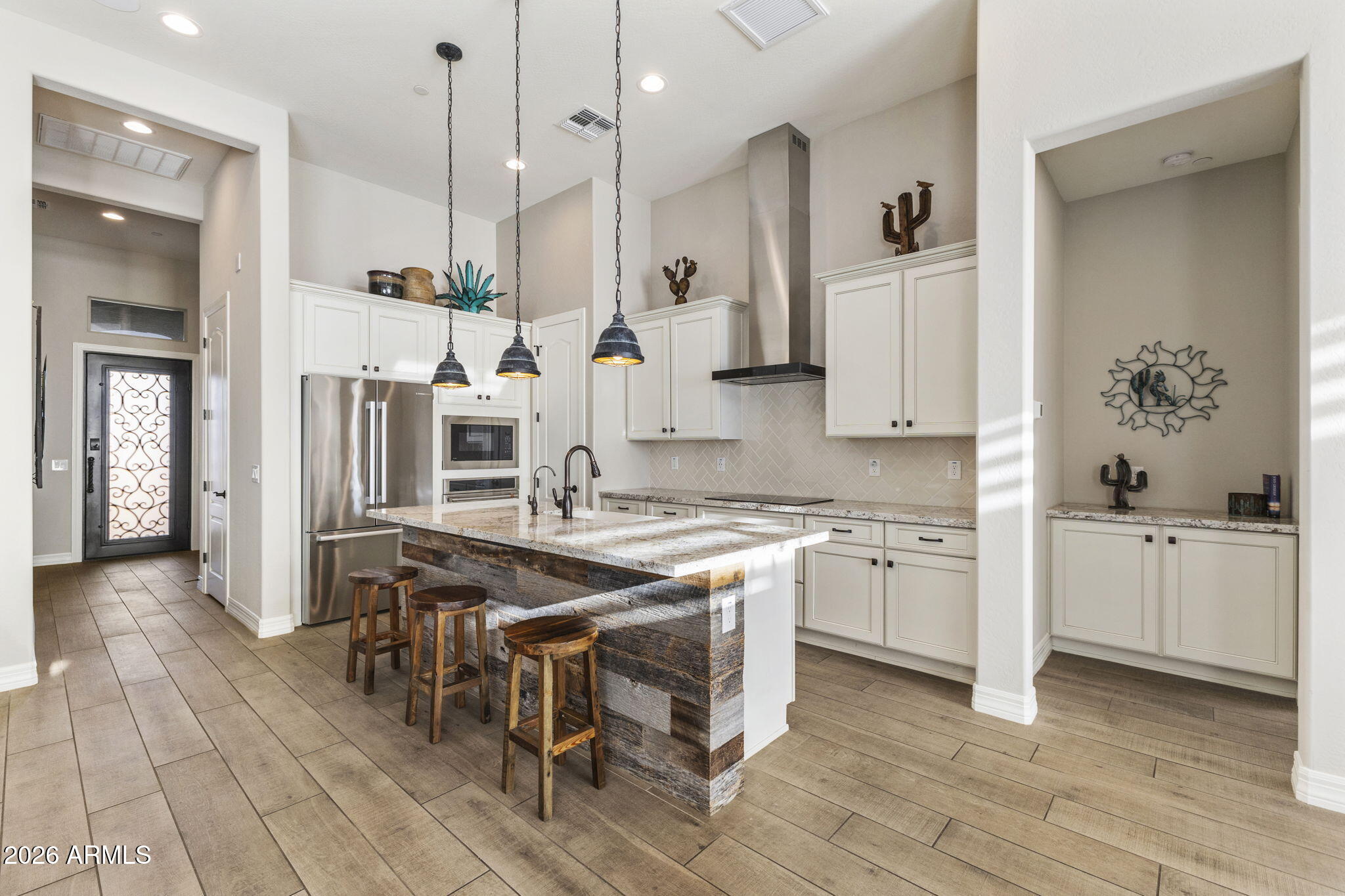 18785 East Blue Sky Drive Rio Verde, AZ 85263 - Photo 2 of 23 a kitchen with stainless steel appliances granite countertop a stove a sink dishwasher and a refrigerator with white cabinets