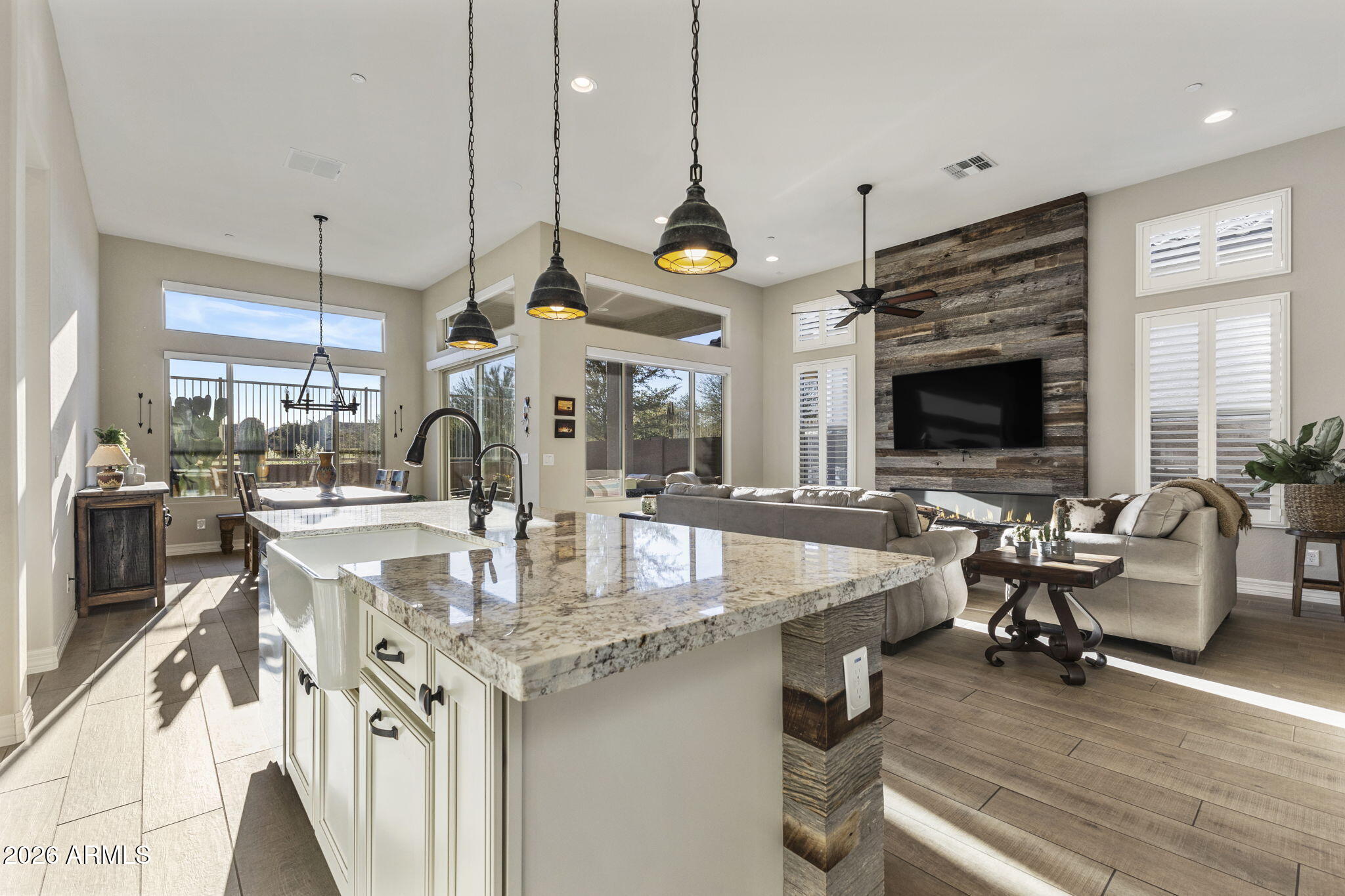 18785 East Blue Sky Drive Rio Verde, AZ 85263 - Photo 4 of 23 a kitchen with stainless steel appliances granite countertop a stove and a view of living room
