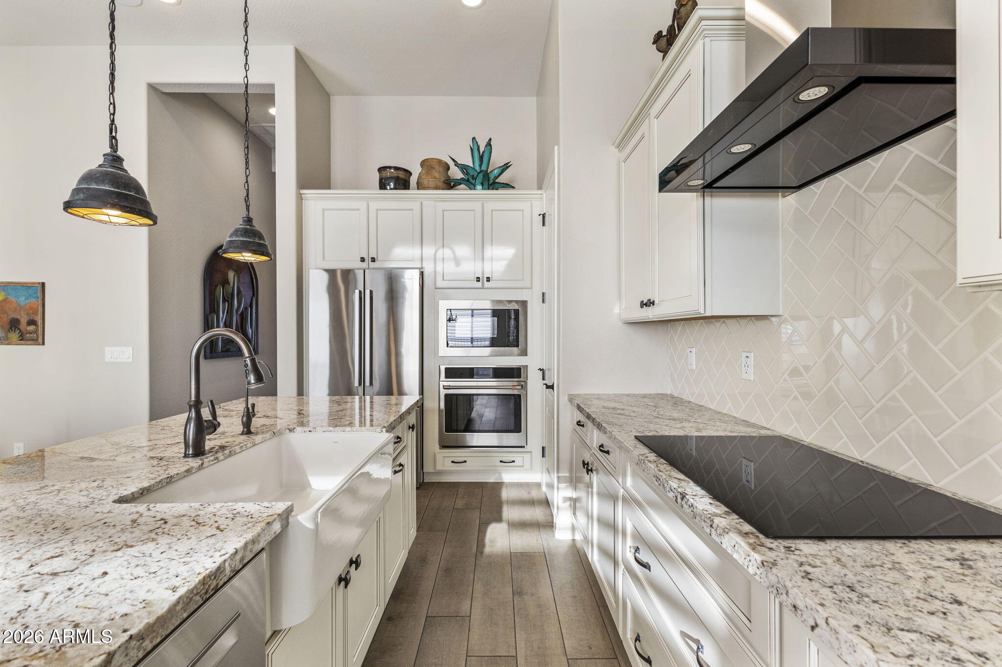 18785 East Blue Sky Drive Rio Verde, AZ 85263 - Photo 5 of 23 a kitchen with kitchen island granite countertop a sink and refrigerator