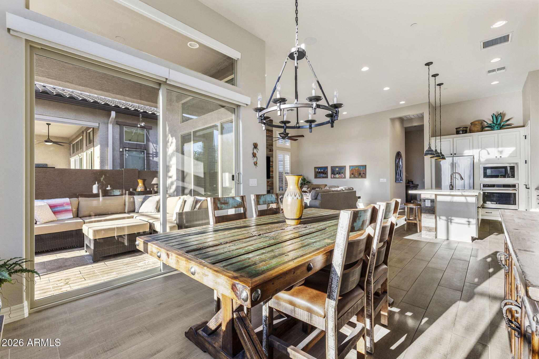 18785 East Blue Sky Drive Rio Verde, AZ 85263 - Photo 6 of 23 a living room with lots of furniture and a chandelier
