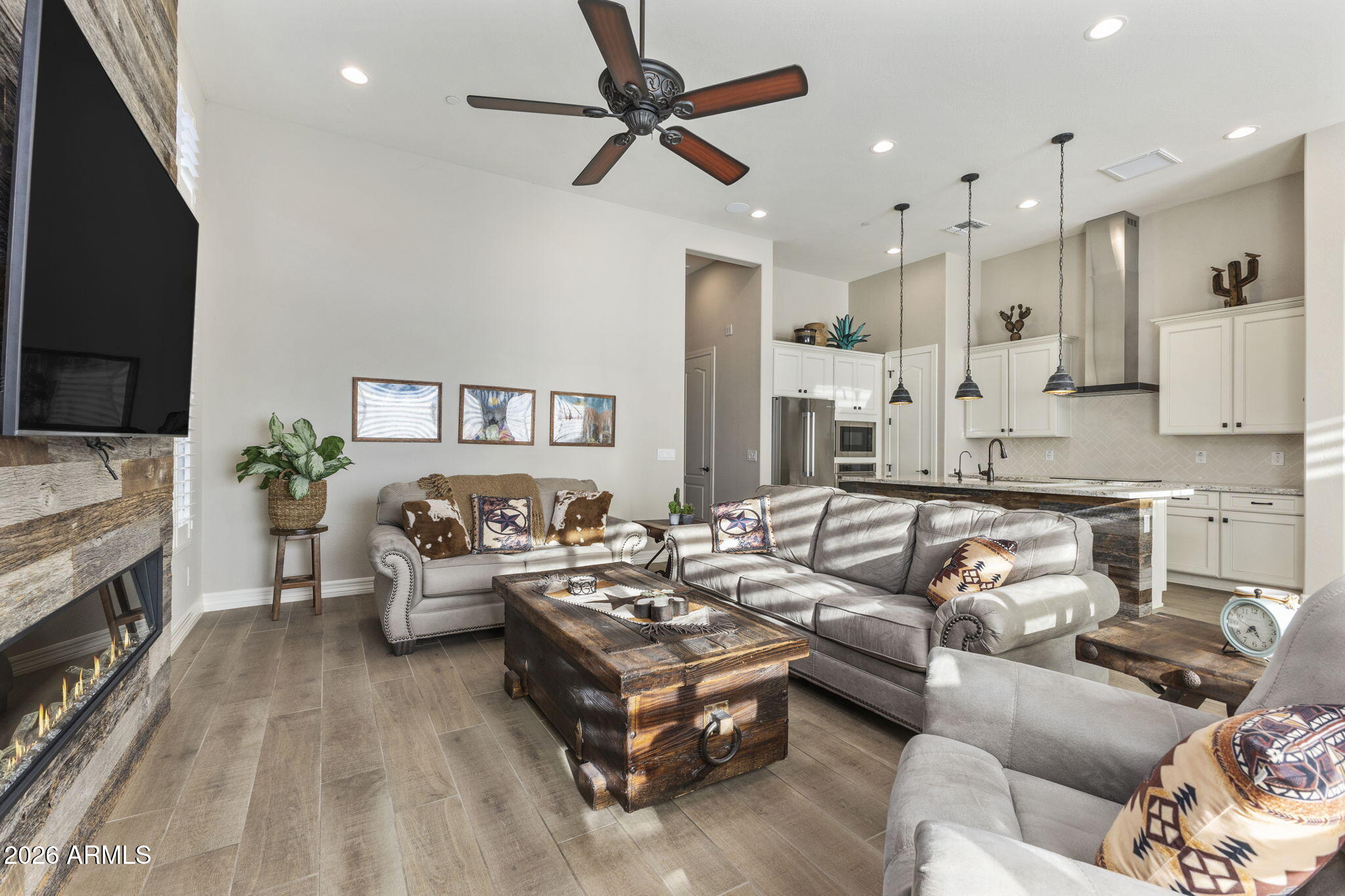 18785 East Blue Sky Drive Rio Verde, AZ 85263 - Photo 8 of 23 a living room with furniture and a flat screen tv
