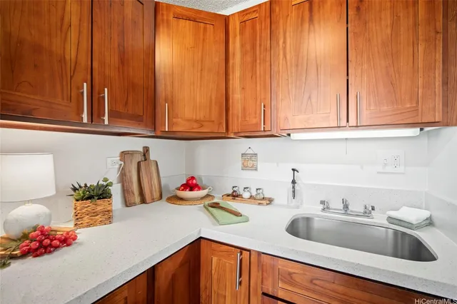 a kitchen with a sink cabinets and utility