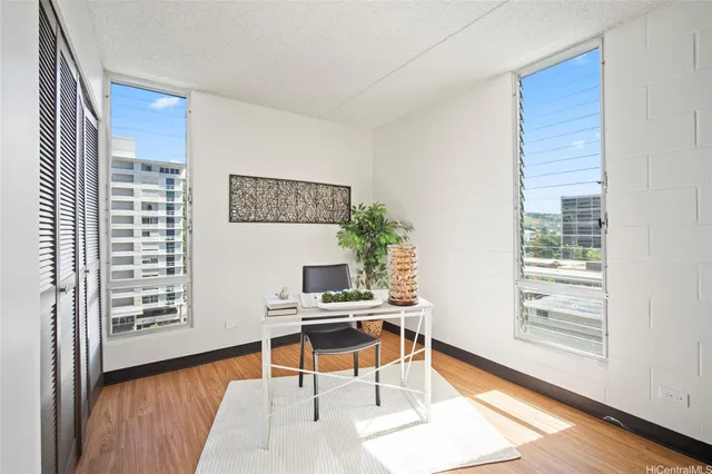 a workspace with furniture and a window