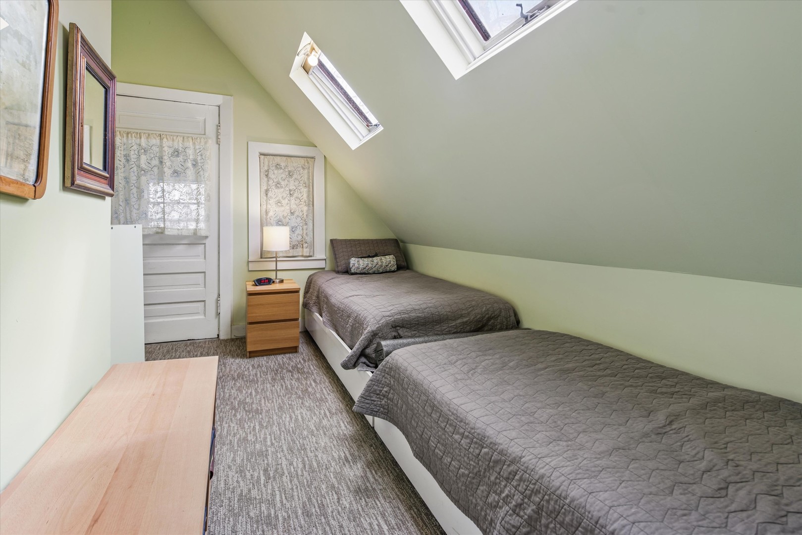 3135 North Seminary Avenue, Unit 1 Chicago, IL 60657 - Photo 12 of 18 a bedroom with a bed and a cabinets