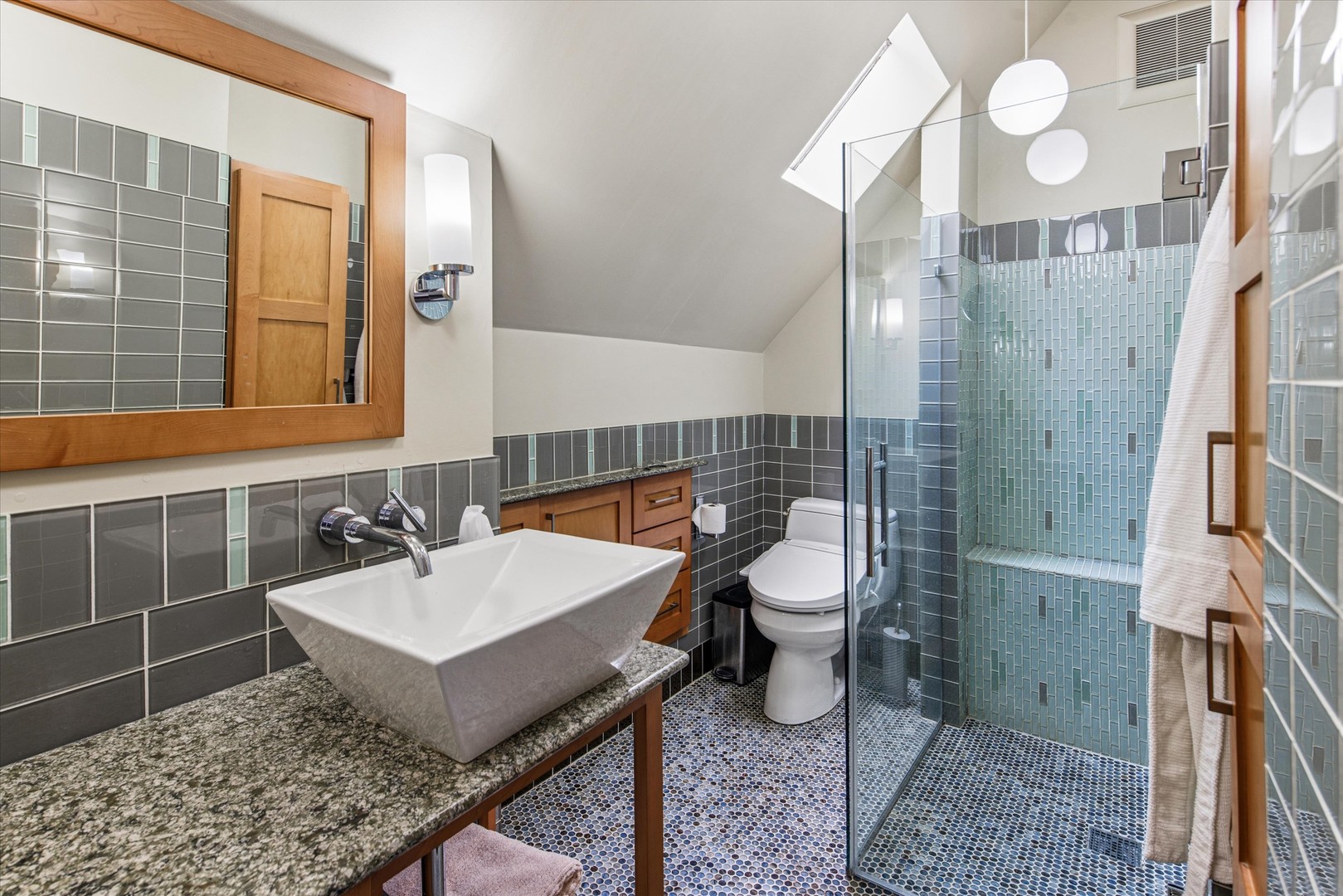 3135 North Seminary Avenue, Unit 1 Chicago, IL 60657 - Photo 13 of 18 a bathroom with a sink toilet and shower