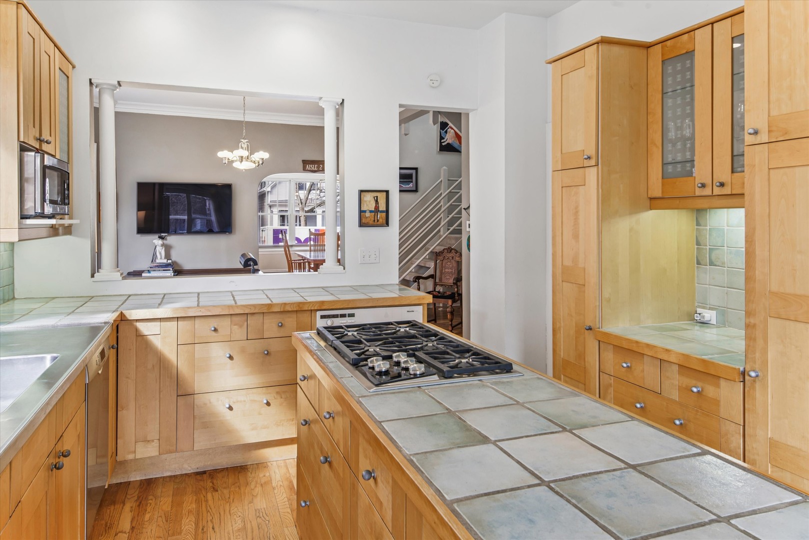 3135 North Seminary Avenue, Unit 1 Chicago, IL 60657 - Photo 6 of 18 a kitchen with stainless steel appliances a stove and a refrigerator
