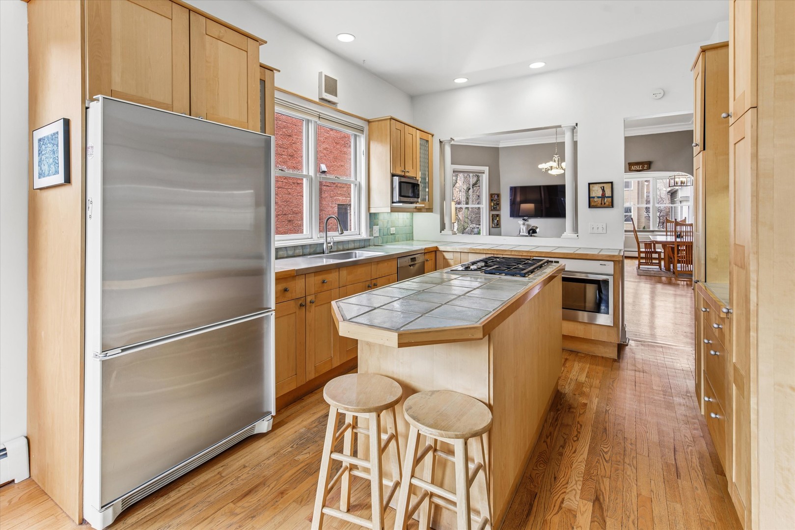 3135 North Seminary Avenue, Unit 1 Chicago, IL 60657 - Photo 7 of 18 a kitchen with a sink stove and refrigerator