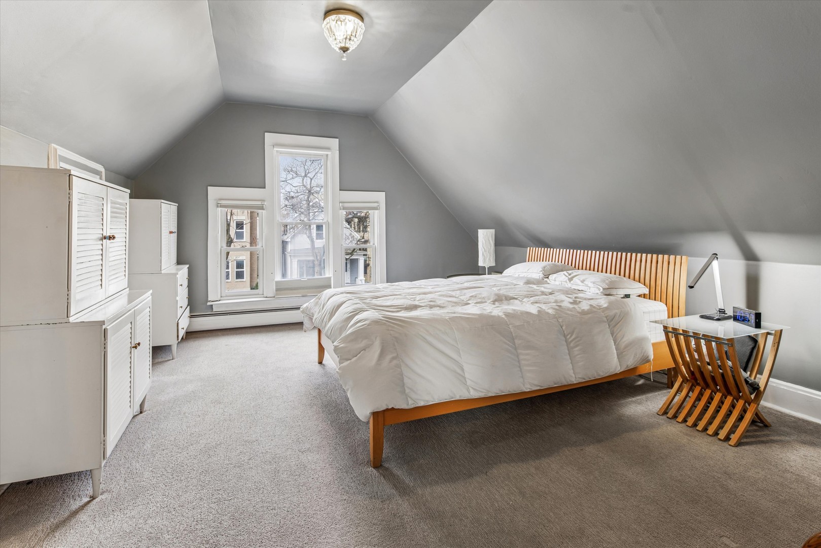 3135 North Seminary Avenue, Unit 1 Chicago, IL 60657 - Photo 10 of 18 a spacious bedroom with a bed and window