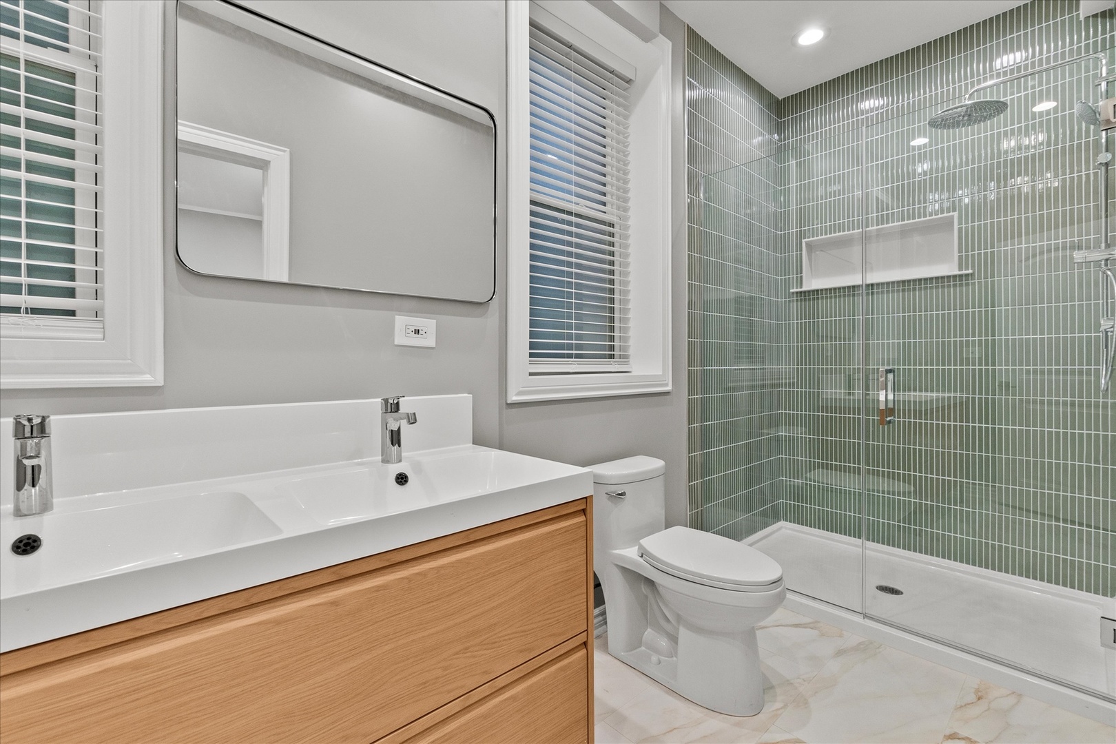 Undisclosed Address Chicago, IL 60614 - Photo 11 of 14 a bathroom with a sink a toilet and shower