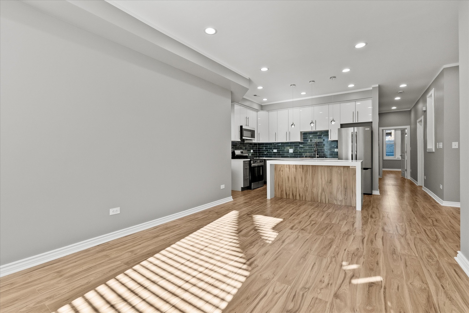 Undisclosed Address Chicago, IL 60614 - Photo 3 of 14 a view of kitchen with cabinets and wooden floor