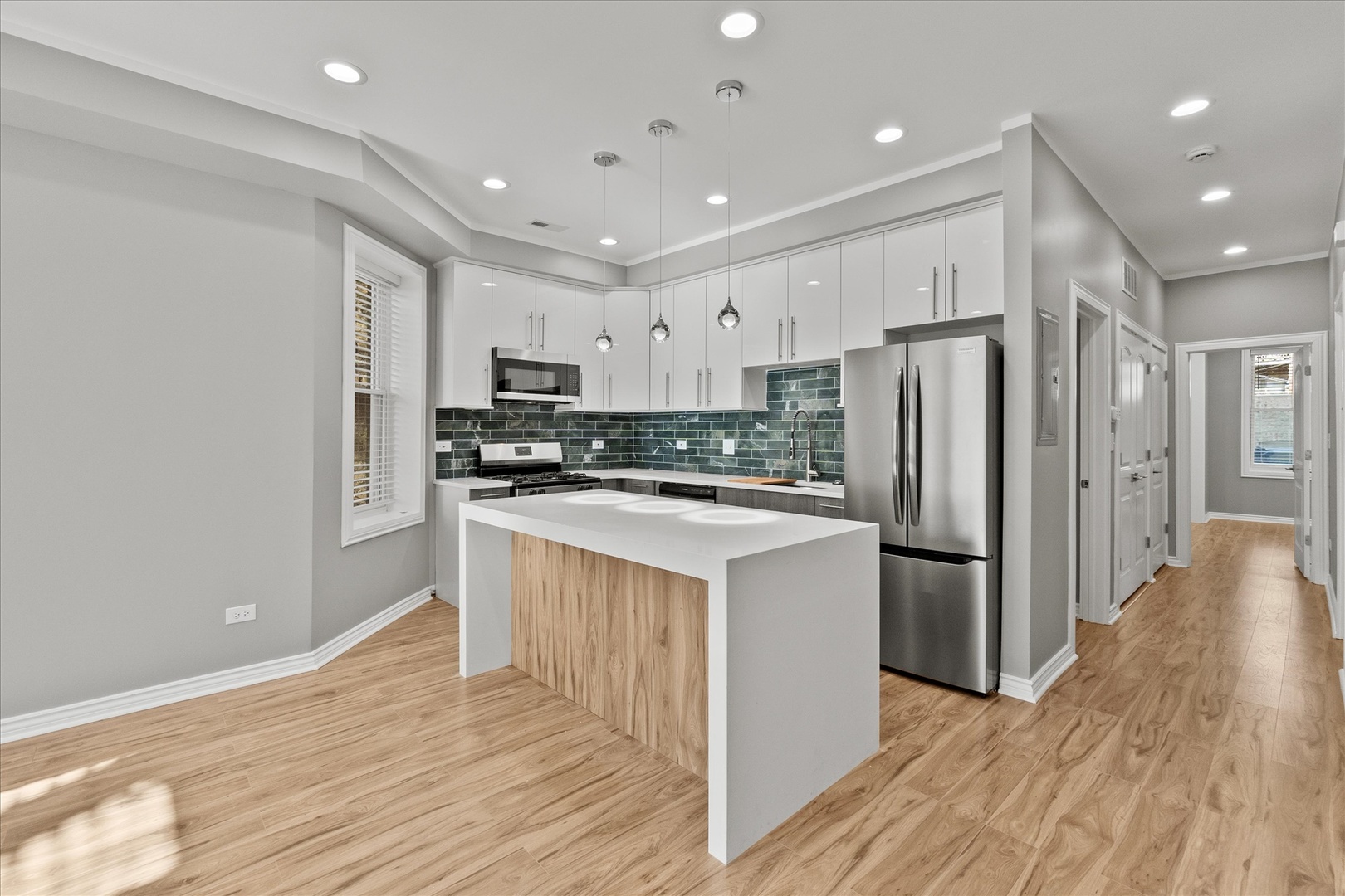 Undisclosed Address Chicago, IL 60614 - Photo 4 of 14 a kitchen with stainless steel appliances granite countertop a refrigerator a stove top oven a sink and dishwasher with wooden floor