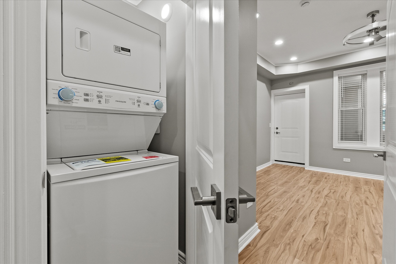 Undisclosed Address Chicago, IL 60614 - Photo 7 of 14 a view of washer and dryer with wooden floor