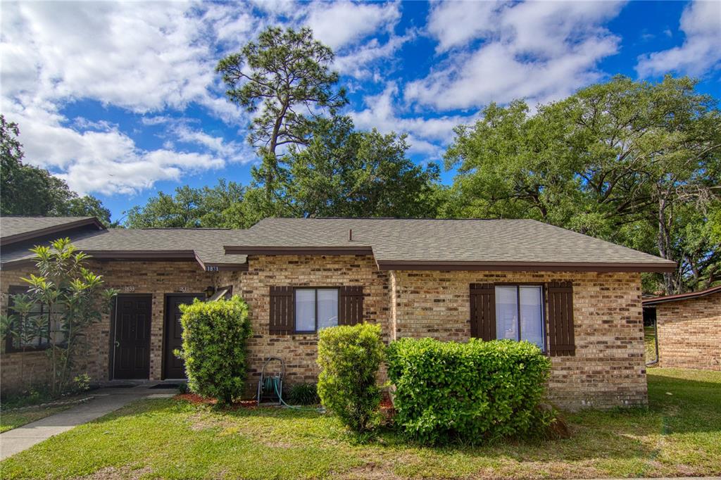 1831 Foxhall Circle Kissimmee, FL 34741 - Photo 1 of 16 front view of a house with a yard