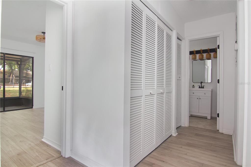 1831 Foxhall Circle Kissimmee, FL 34741 - Photo 13 of 16 a view of a hallway with wooden floor and closet area