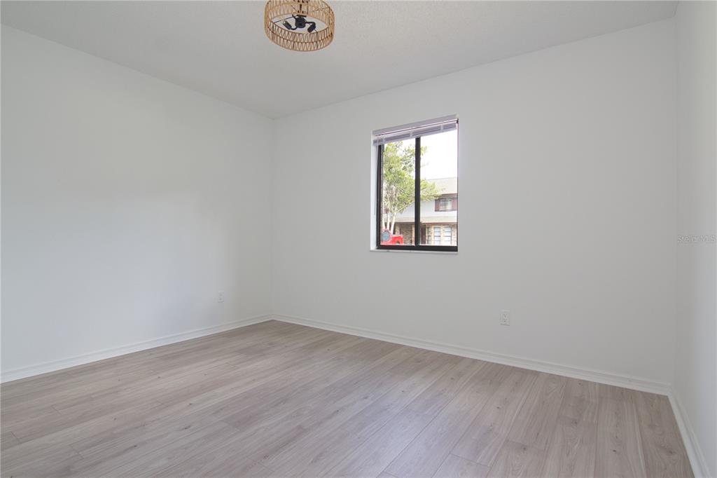 1831 Foxhall Circle Kissimmee, FL 34741 - Photo 14 of 16 an empty room with a window