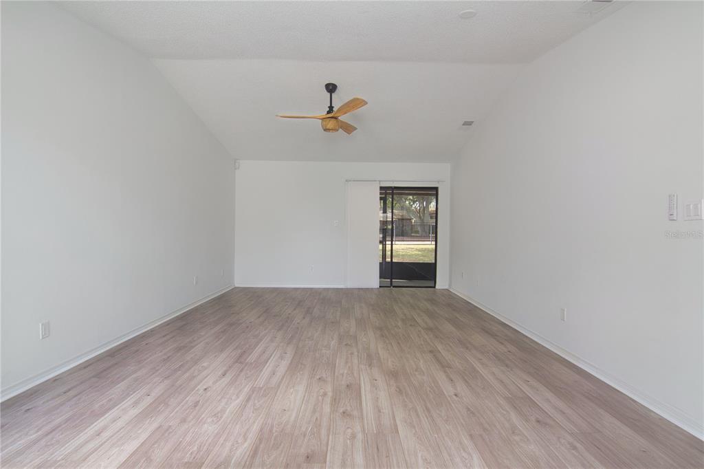 1831 Foxhall Circle Kissimmee, FL 34741 - Photo 15 of 16 wooden floor in an empty room
