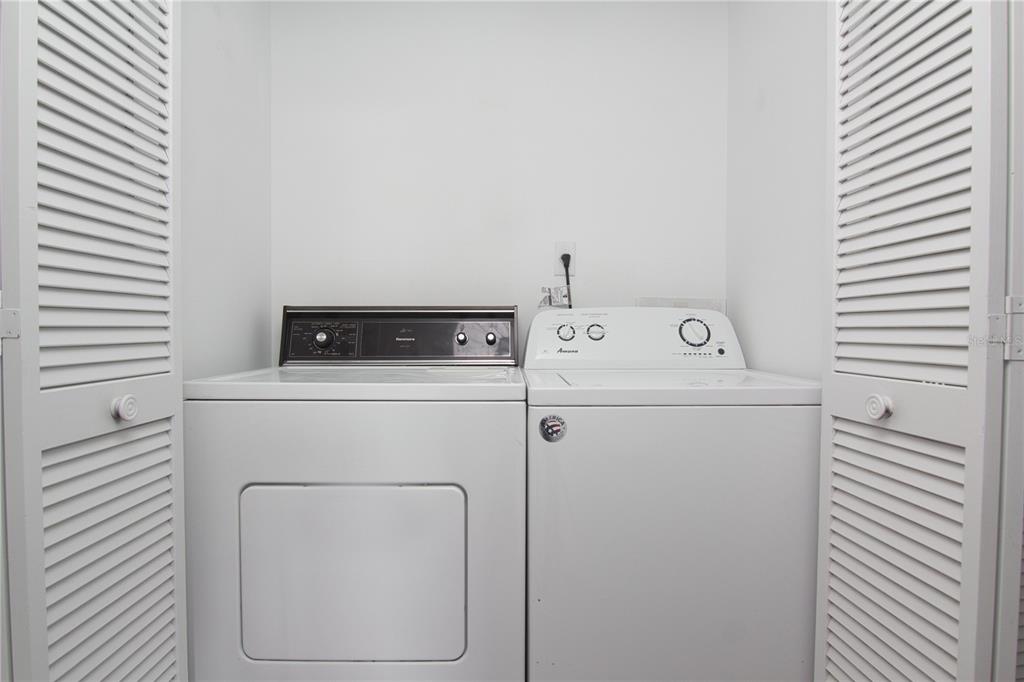 1831 Foxhall Circle Kissimmee, FL 34741 - Photo 16 of 16 a utility room with dryer and washer