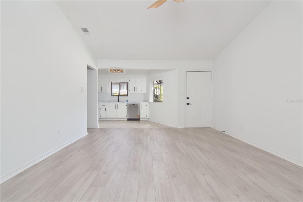 1831 Foxhall Circle Kissimmee, FL 34741 - Photo 8 of 16 a view of empty room with wooden floor