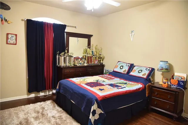 a bed room with a bed and a dresser
