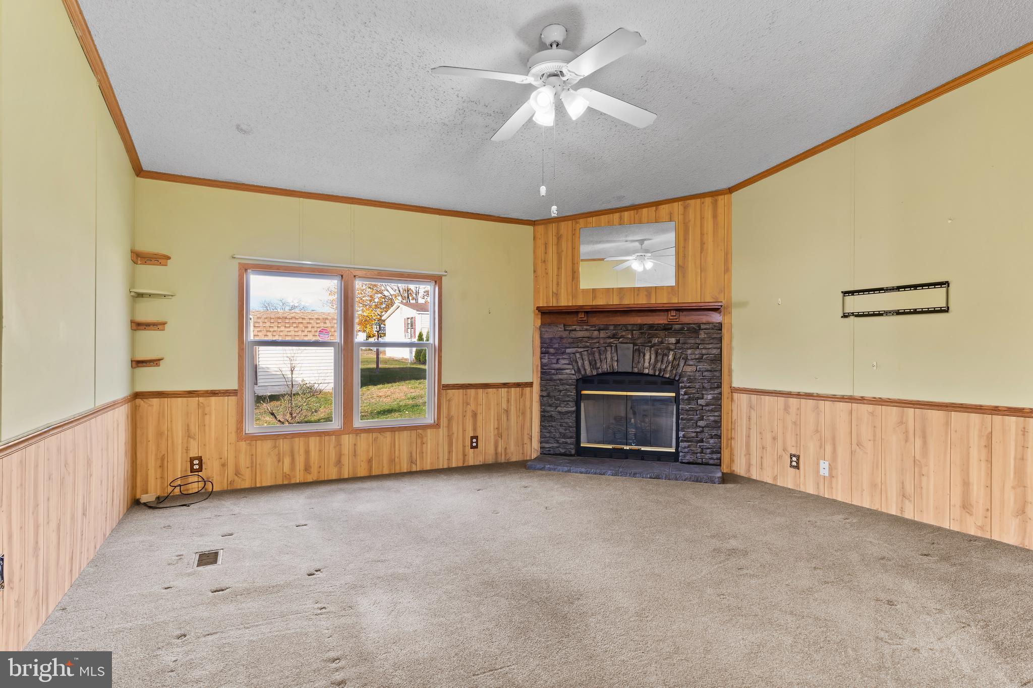 21 Hidden Noll Road Carlisle, PA 17013 - Photo 11 of 25 a view of an empty room with a fireplace and a window