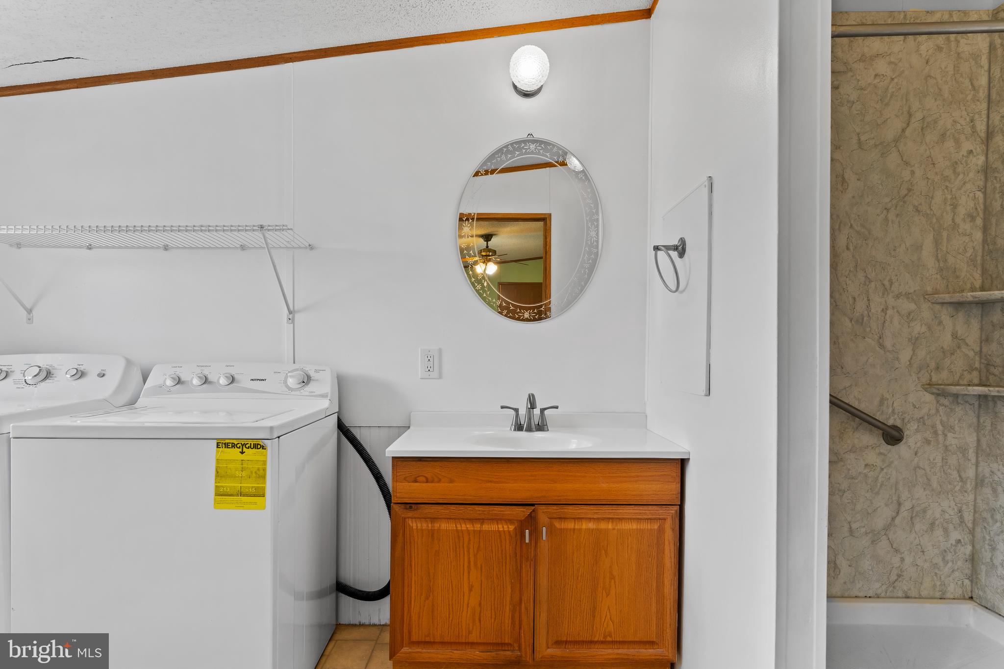 21 Hidden Noll Road Carlisle, PA 17013 - Photo 14 of 25 a bathroom with a sink mirror and vanity