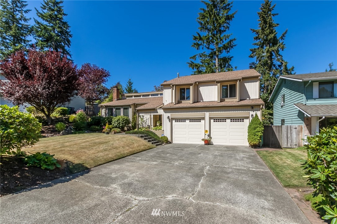 15612 Southeast 178th Street Renton, WA 98058 - Photo 2 of 40 a view of a house with a yard and potted plants