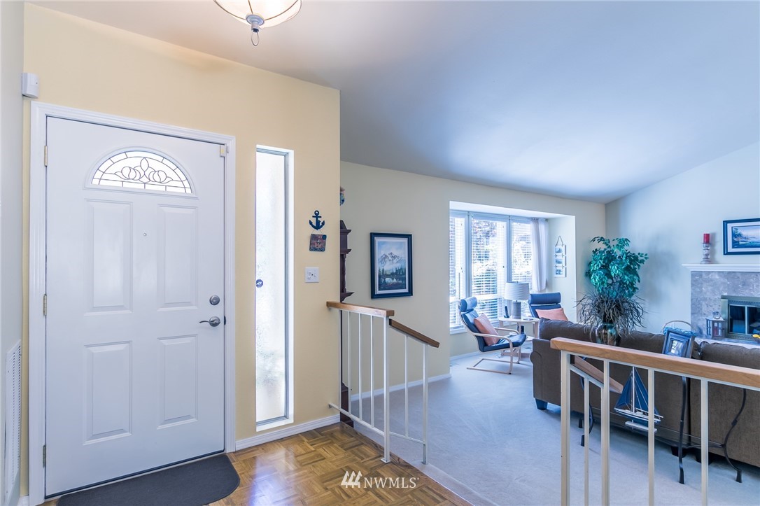 15612 Southeast 178th Street Renton, WA 98058 - Photo 14 of 40 a view of a livingroom with furniture and hardwood floor
