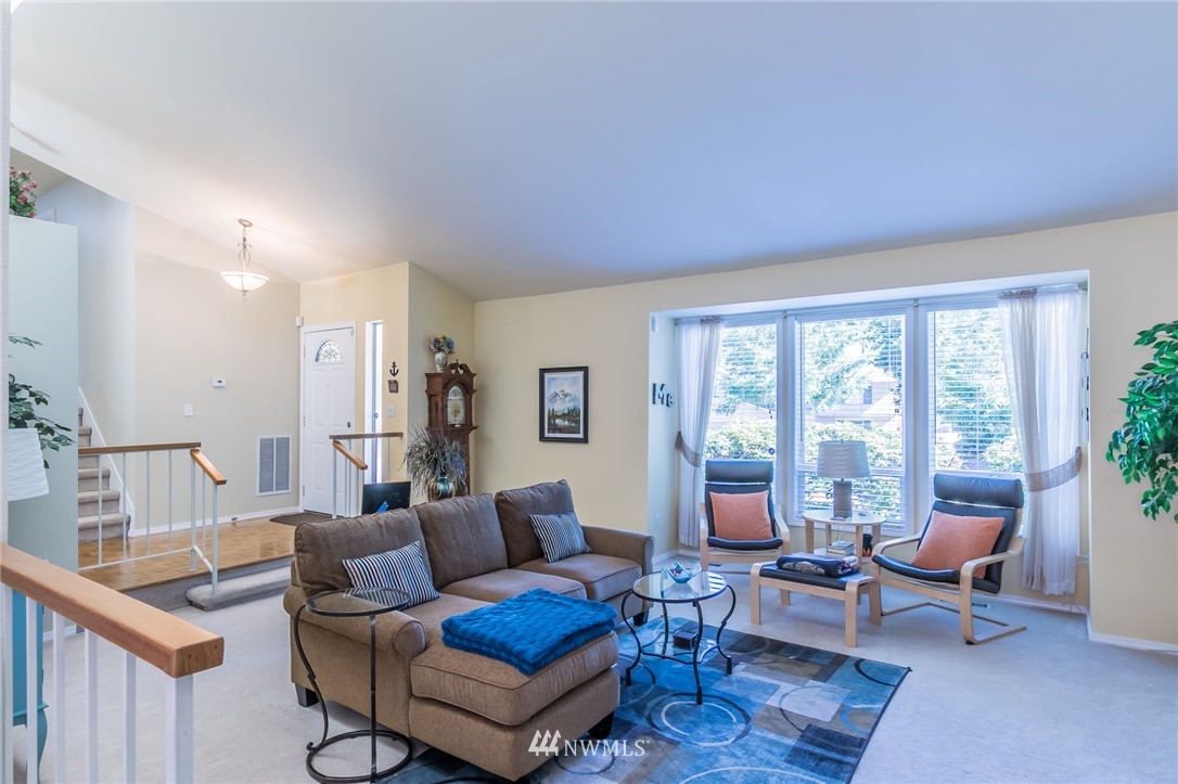 15612 Southeast 178th Street Renton, WA 98058 - Photo 17 of 40 a living room with furniture and a large window