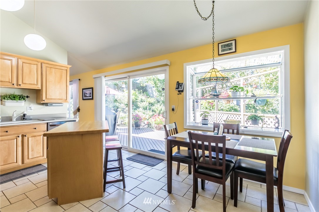 15612 Southeast 178th Street Renton, WA 98058 - Photo 25 of 40 a view of a dining room with furniture window and outside view