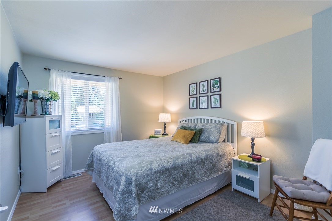 15612 Southeast 178th Street Renton, WA 98058 - Photo 33 of 40 a bedroom with a large bed and a window