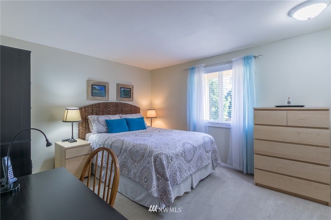 15612 Southeast 178th Street Renton, WA 98058 - Photo 35 of 40 a bedroom with a bed and a dresser