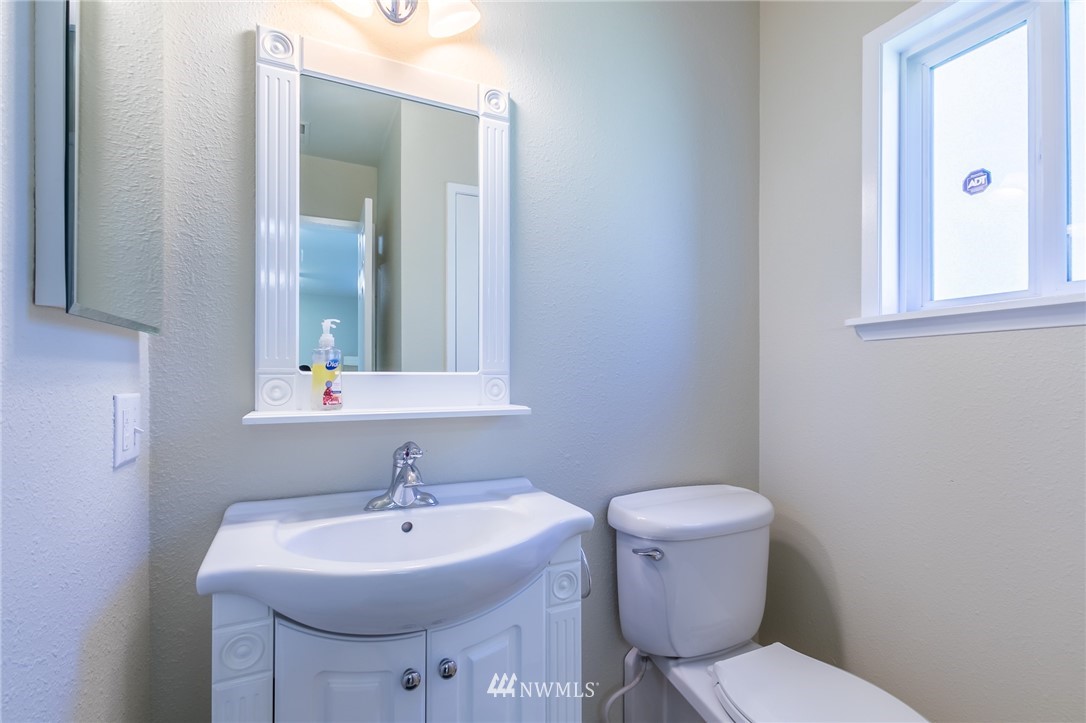 15612 Southeast 178th Street Renton, WA 98058 - Photo 39 of 40 a bathroom with a toilet sink and mirror