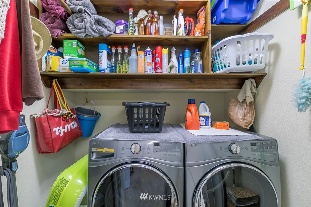 15612 Southeast 178th Street Renton, WA 98058 - Photo 40 of 40 a utility room with dryer and baby shelf