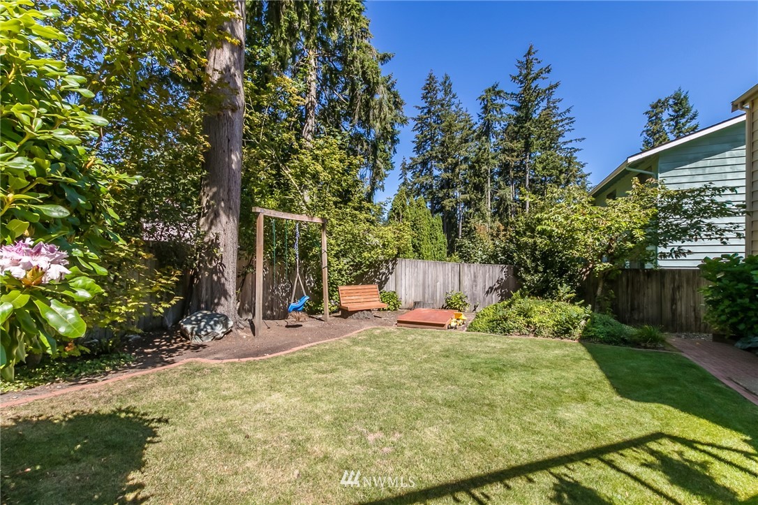 15612 Southeast 178th Street Renton, WA 98058 - Photo 10 of 40 a view of a backyard with a small cabin
