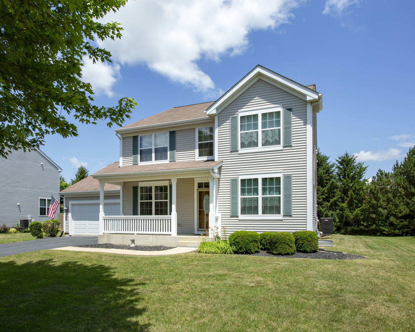 220 Stearn Drive Genoa, IL 60135 - Photo 1 of 42 a front view of a house with a yard