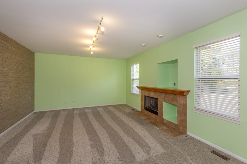220 Stearn Drive Genoa, IL 60135 - Photo 12 of 42 a view of empty room with a fireplace and a window