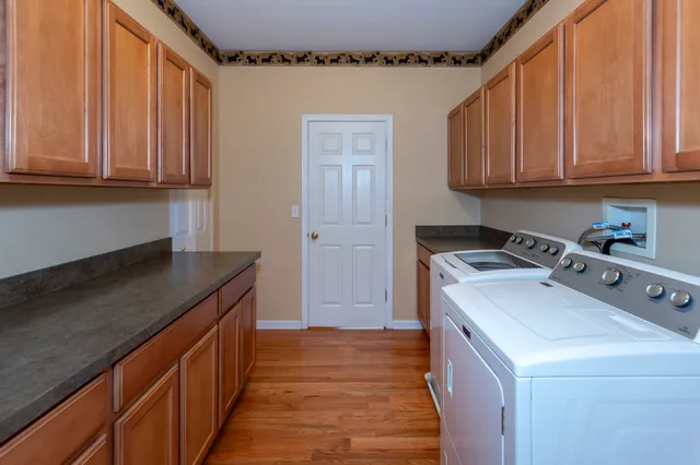 a kitchen with a sink a stove and cabinets