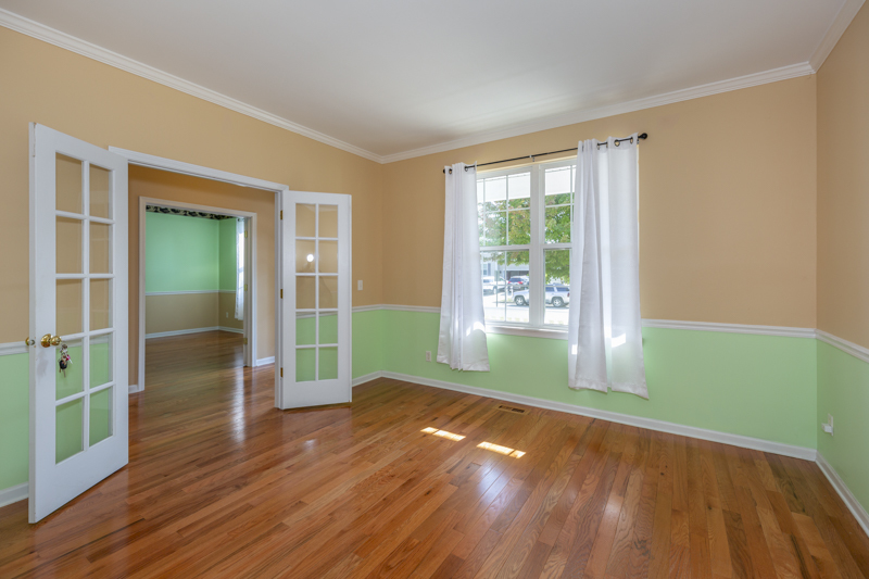 220 Stearn Drive Genoa, IL 60135 - Photo 15 of 42 a view of empty room with wooden floor and fan