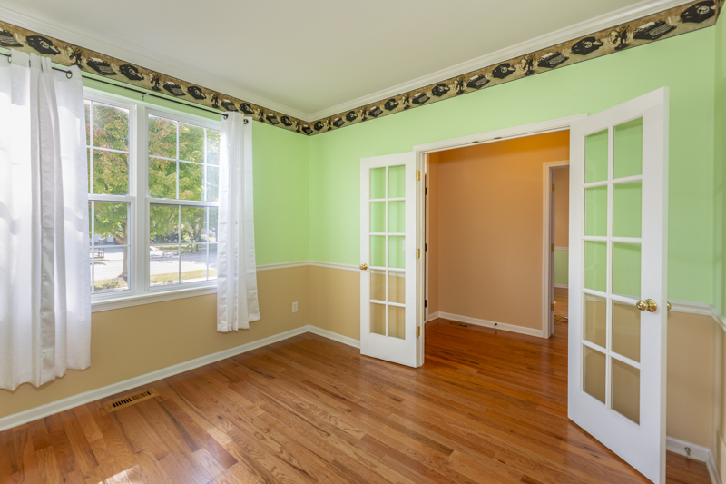 220 Stearn Drive Genoa, IL 60135 - Photo 18 of 42 a view of an empty room with wooden floor and a window