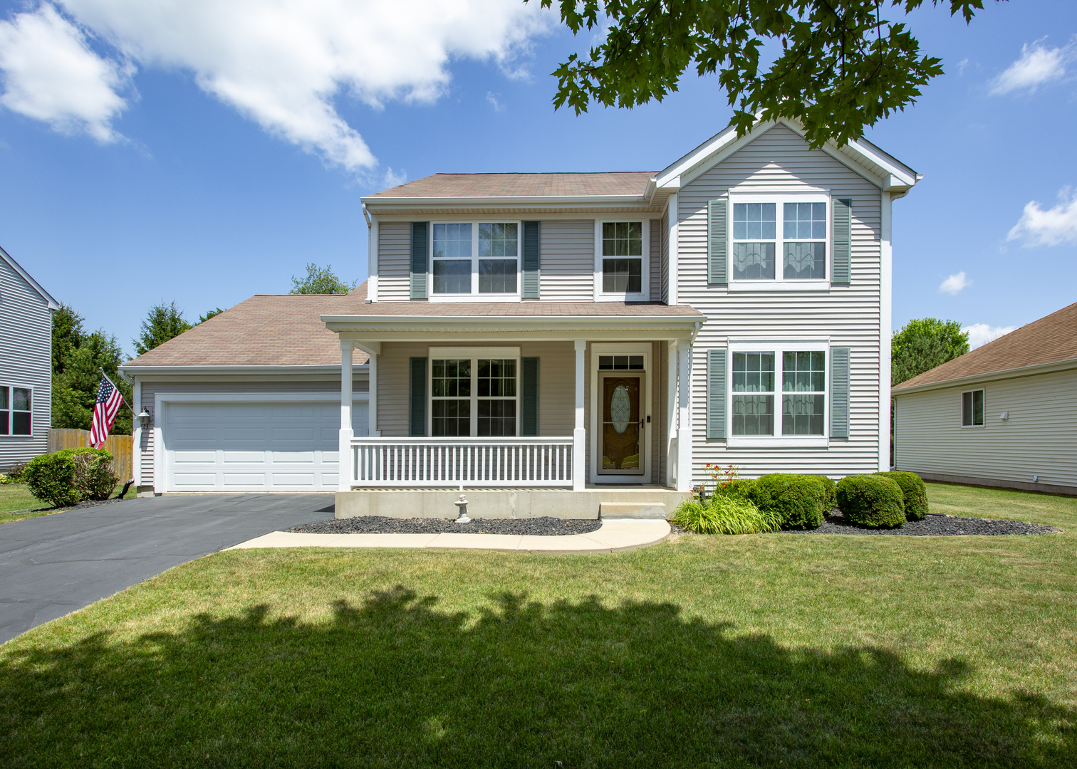 220 Stearn Drive Genoa, IL 60135 - Photo 2 of 42 a front view of a house with a yard