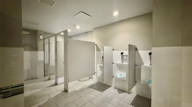 a view of a tennis ground with a small yard