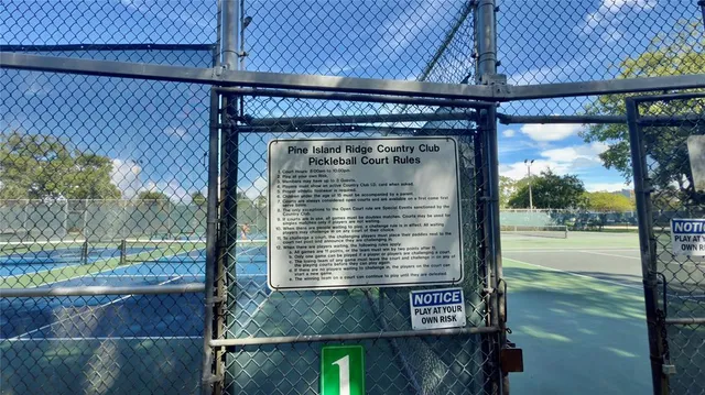 a view of a park with swings and slides