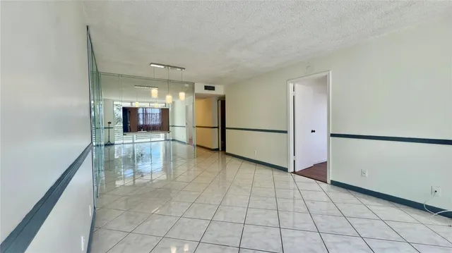 a kitchen with a refrigerator sink and stove
